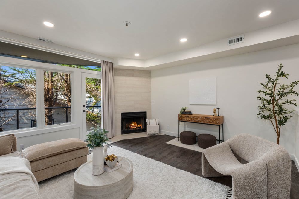 Living room with fireplace at 9039 NE Juanita Drive #307